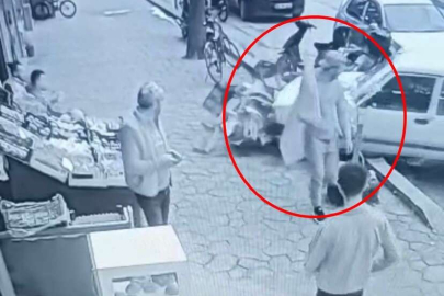 Otomobilin altında kalmaktan saniyelerle kurtuldu, rahat tavırları dikkat çekti