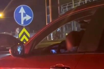 Kucağında çocukla araç kullanan sürücüye tepki yağdı